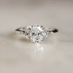 Diamond ring on a light background and marble surface