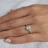 white gold diamond cluster engagement ring worn on hand