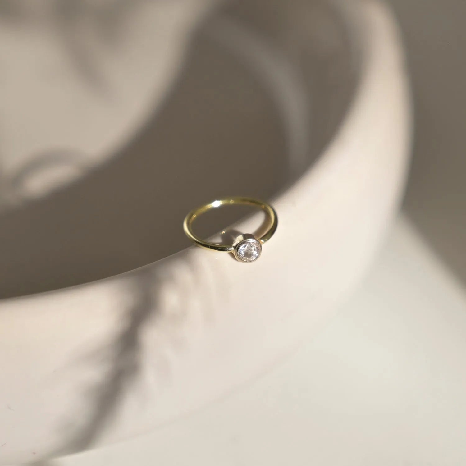 solid gold diamond helix earring on plate