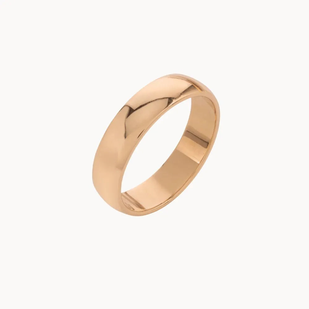 Rose gold ring on a white background