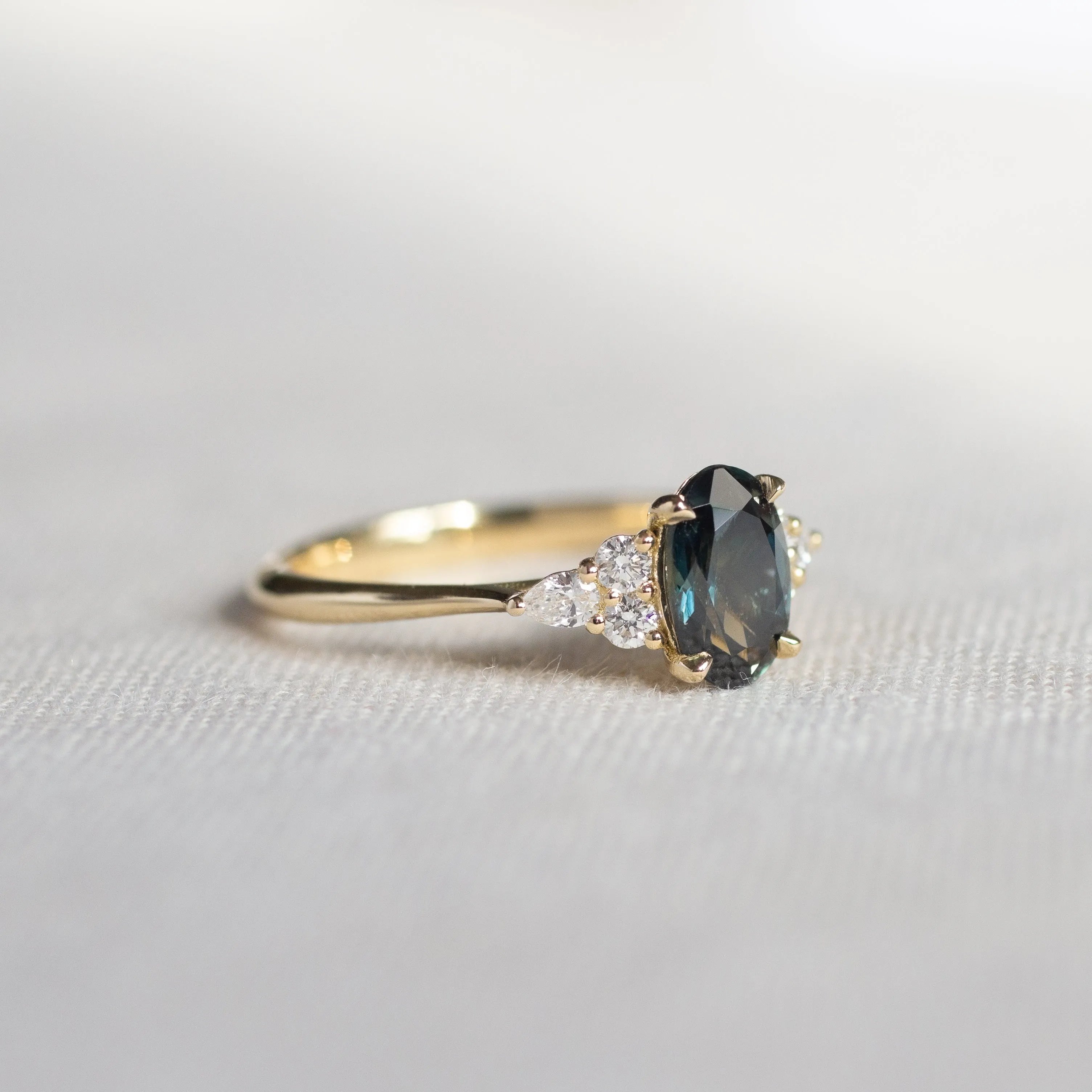 7-Stone Blue/Green Sapphire Engagement Ring with Diamond Cluster