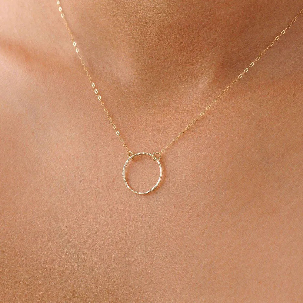 model wearing 9ct gold circle necklace