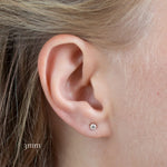 close up of ear wearing white gold 3mm diamond stud in lobe