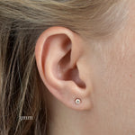 close up of ear wearing yellow gold diamond studs in 3mm