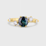 Asymmetrical Round Blue Sapphire Engagement Ring with Sprinkled Diamonds
