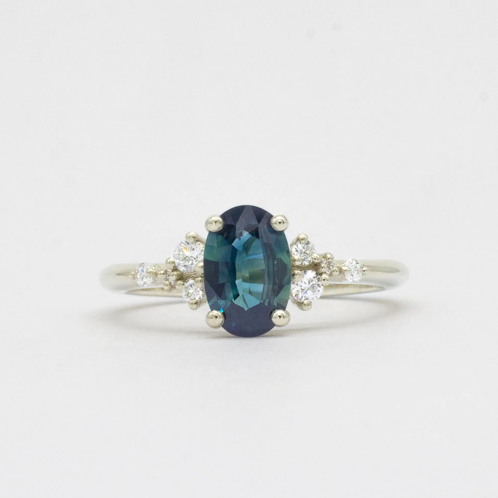 Blue Sapphire Engagement Ring with Scattered Diamonds
