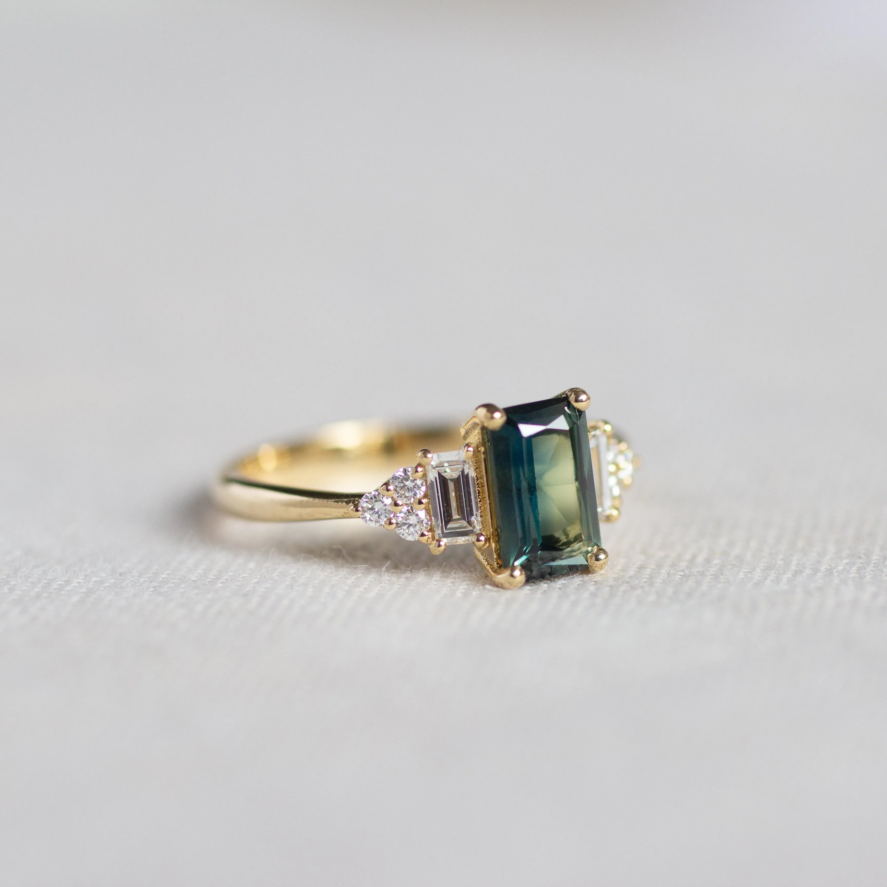 Blue/Green Sapphire Baguette with Diamond Cluster Engagement Ring