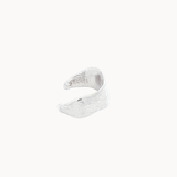 Silver ear cuff side view on a white background