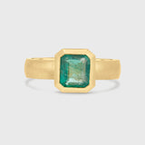 Emerald solitaire wide band engagement ring