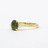 Forest green sapphire engagement ring side angle with yellow gold shank
