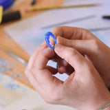 hands holding wax mould of ring at our london jewellery making workshops