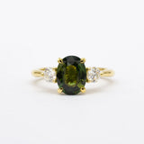 Large green sapphire engagement ring with diamonds