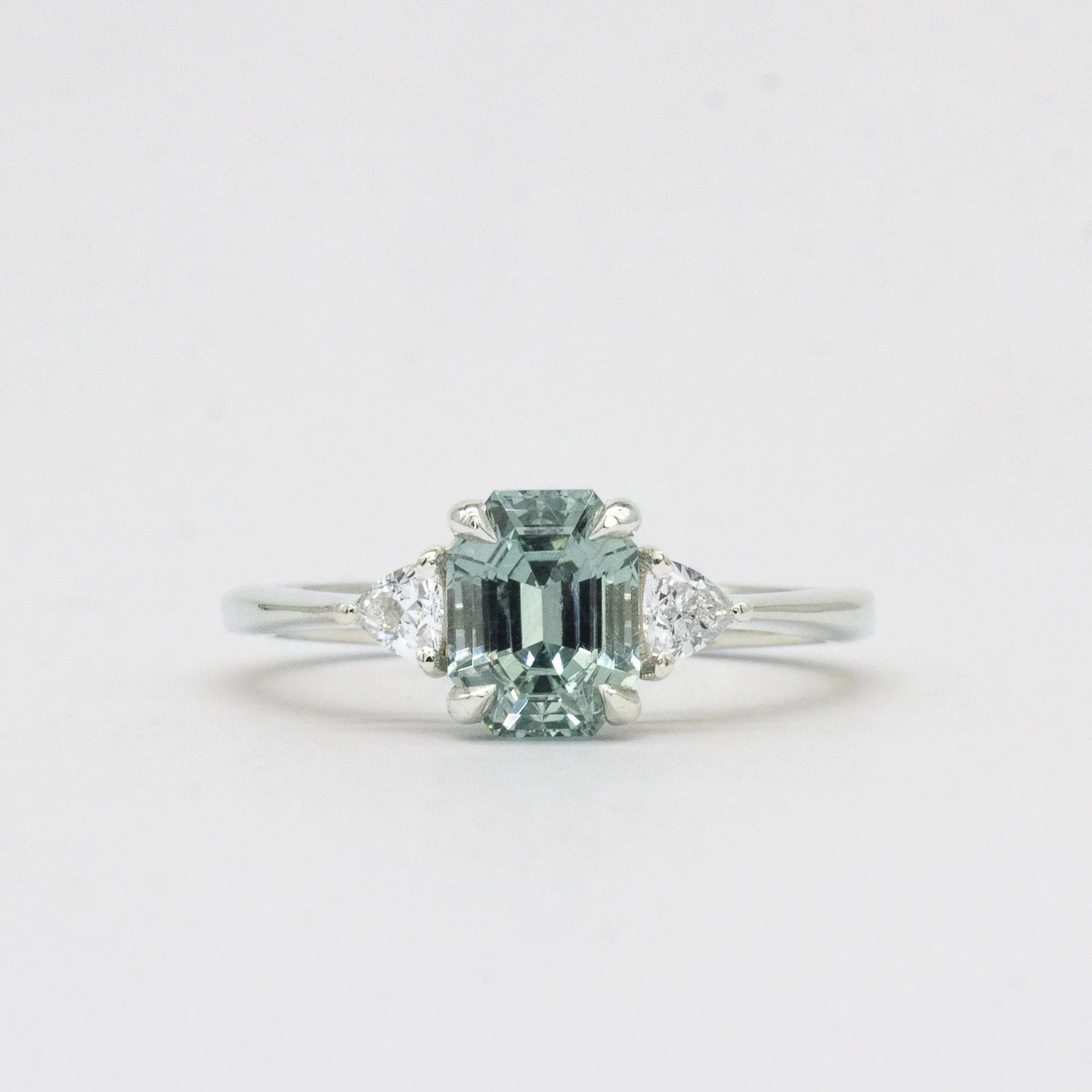 Light Blue Sapphire Engagement Ring with Trillion Cut Diamonds