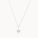 Silver necklace with a small acorn-shaped pendant on a white background