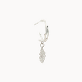 Silver leaf-shaped earring on a white background