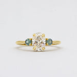 Oval Diamond and Green Tourmaline Trilogy Engagement Ring