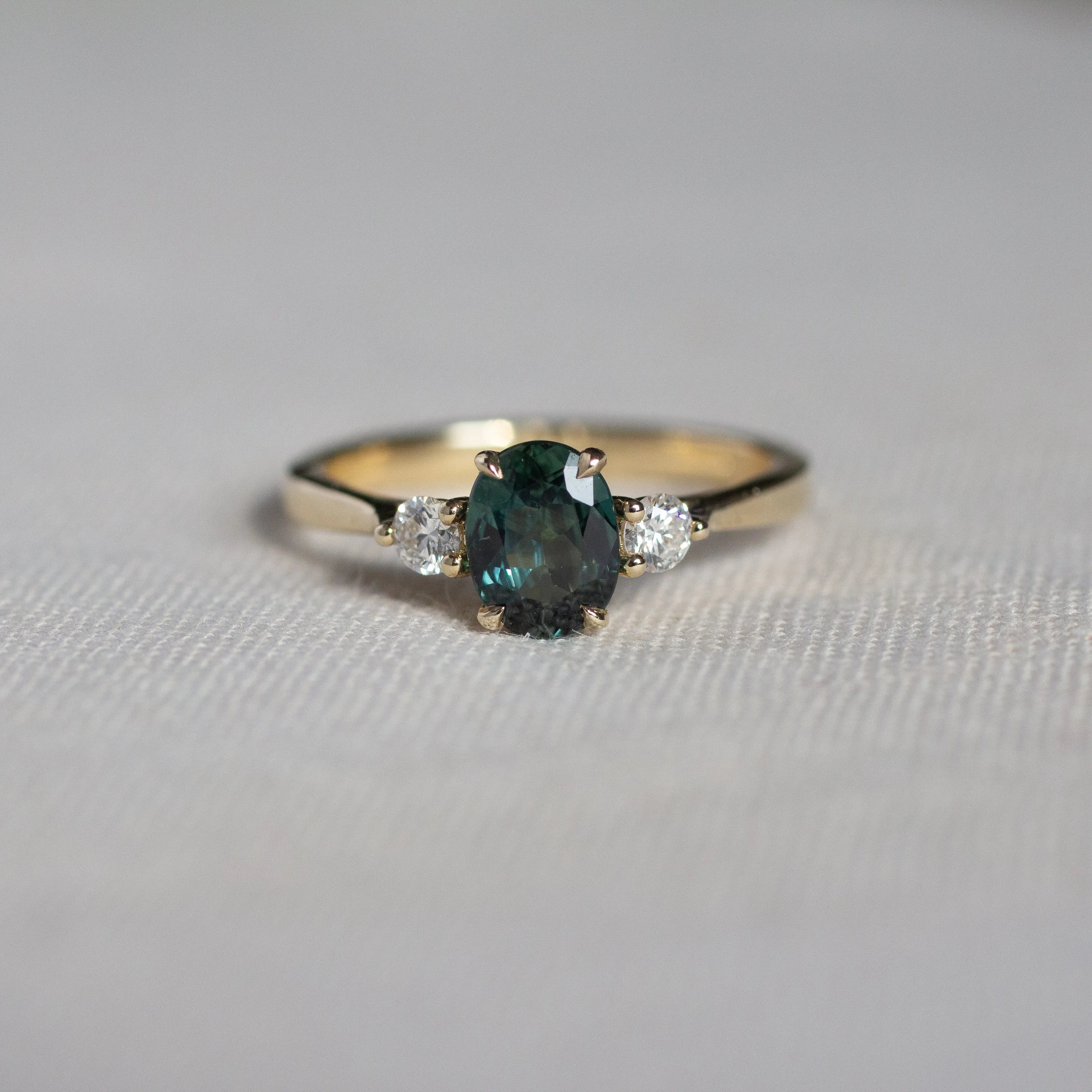 Peacock Blue/Green Oval Sapphire Engagement Ring with Round Diamonds