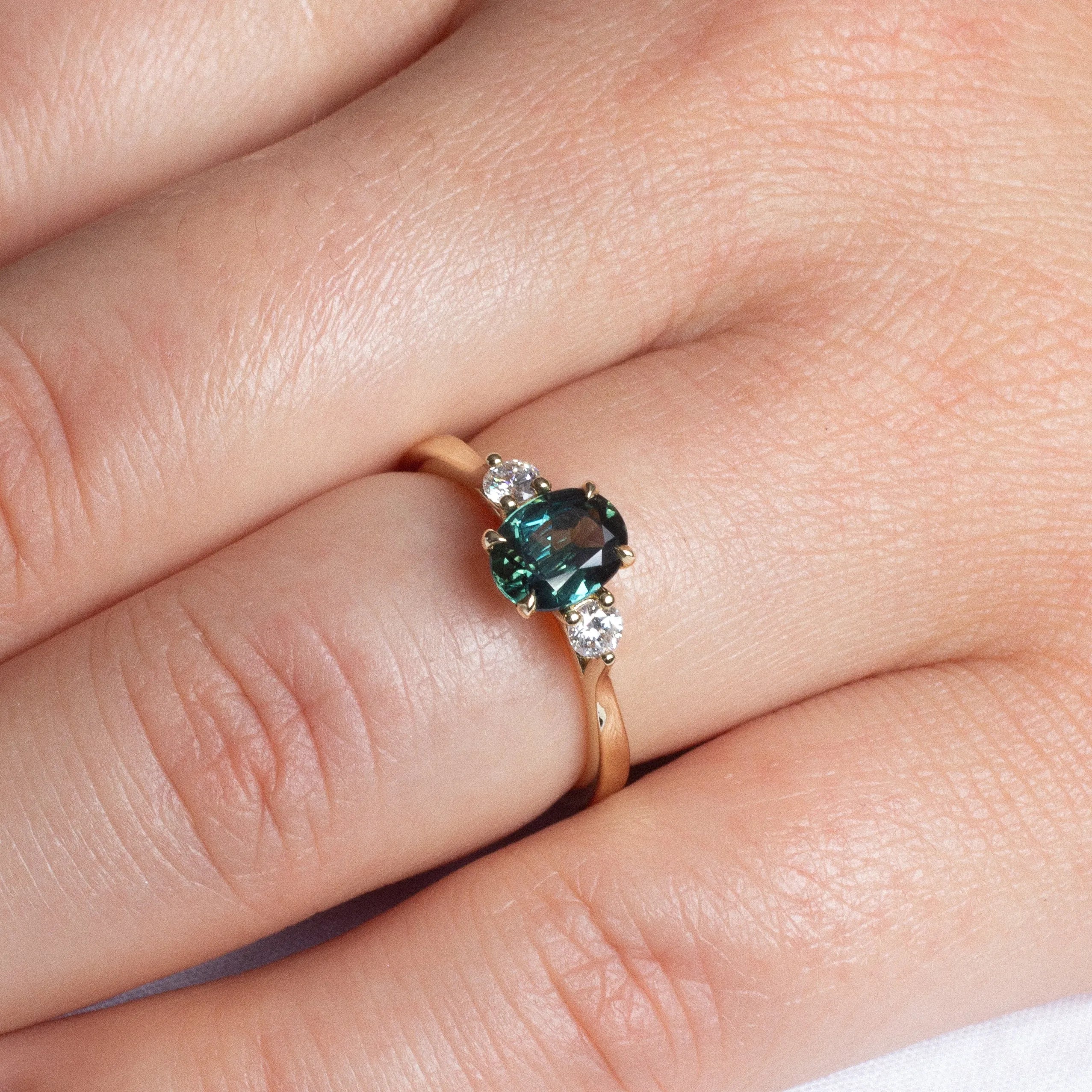Peacock Blue/Green Oval Sapphire Engagement Ring with Round Diamonds