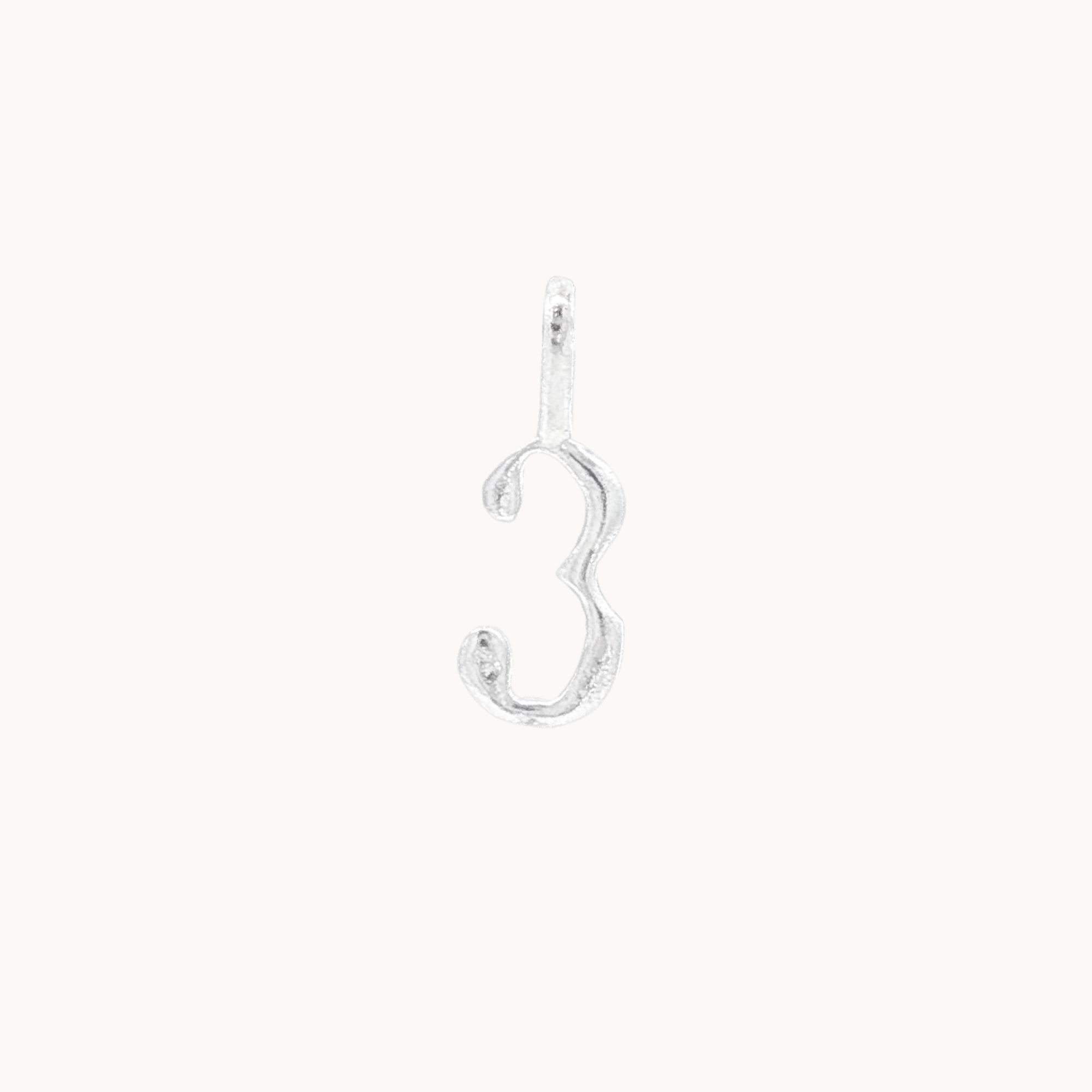 Silver number '3' pendant on a white background