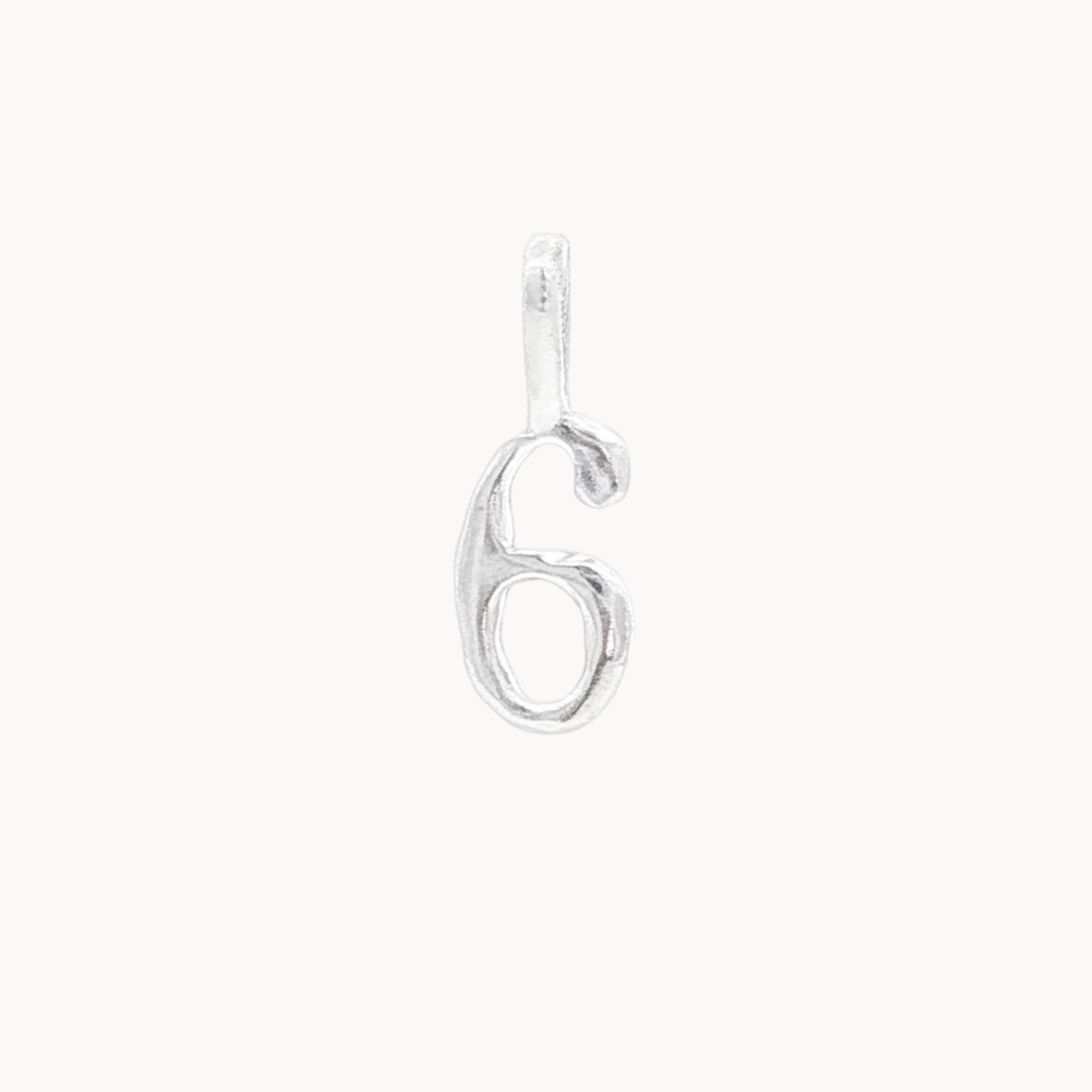 Silver number '6' pendant on a white background