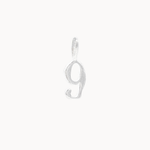 Silver number '9' pendant on a white background