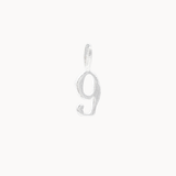 Silver number '9' pendant on a white background