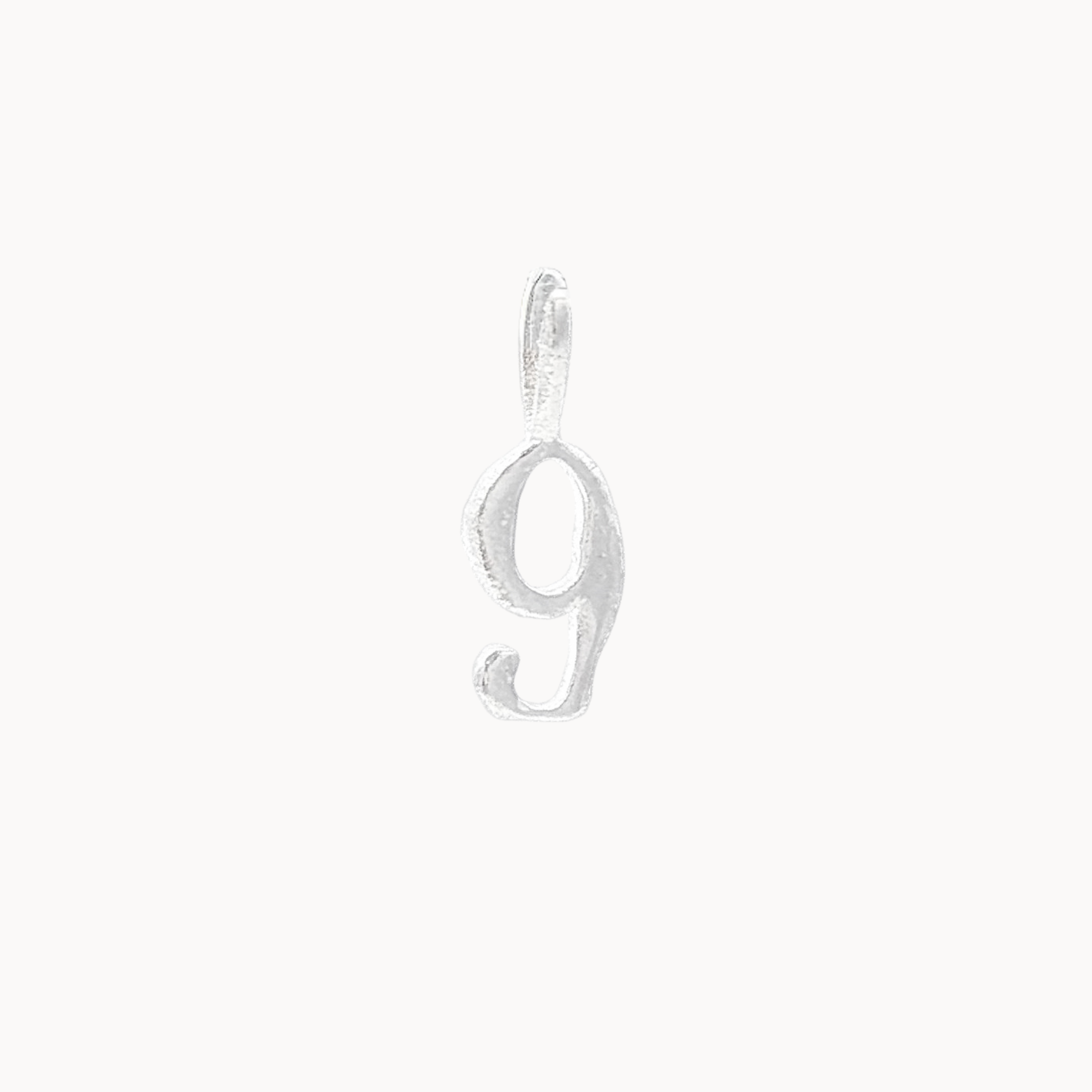 Silver number '9' pendant on a white background