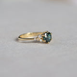 Round Green Sapphire Engagement Ring with Scattered Diamonds