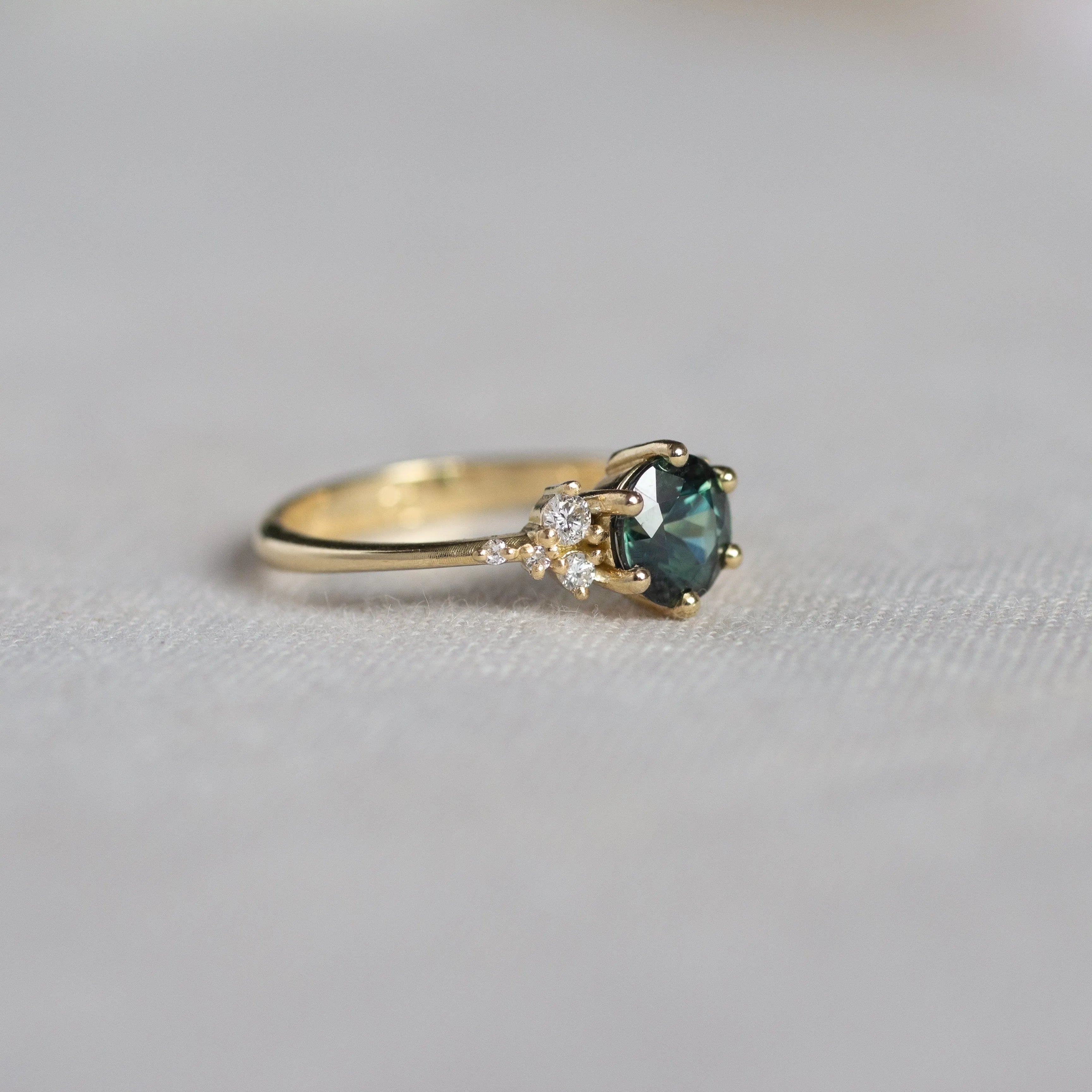Round Green Sapphire Engagement Ring with Scattered Diamonds