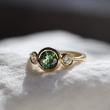 Round bezel set sapphire engagement ring