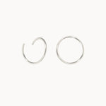 Silver hoop earrings on a white background