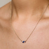 blue and yellow sapphire diamond necklace being worn