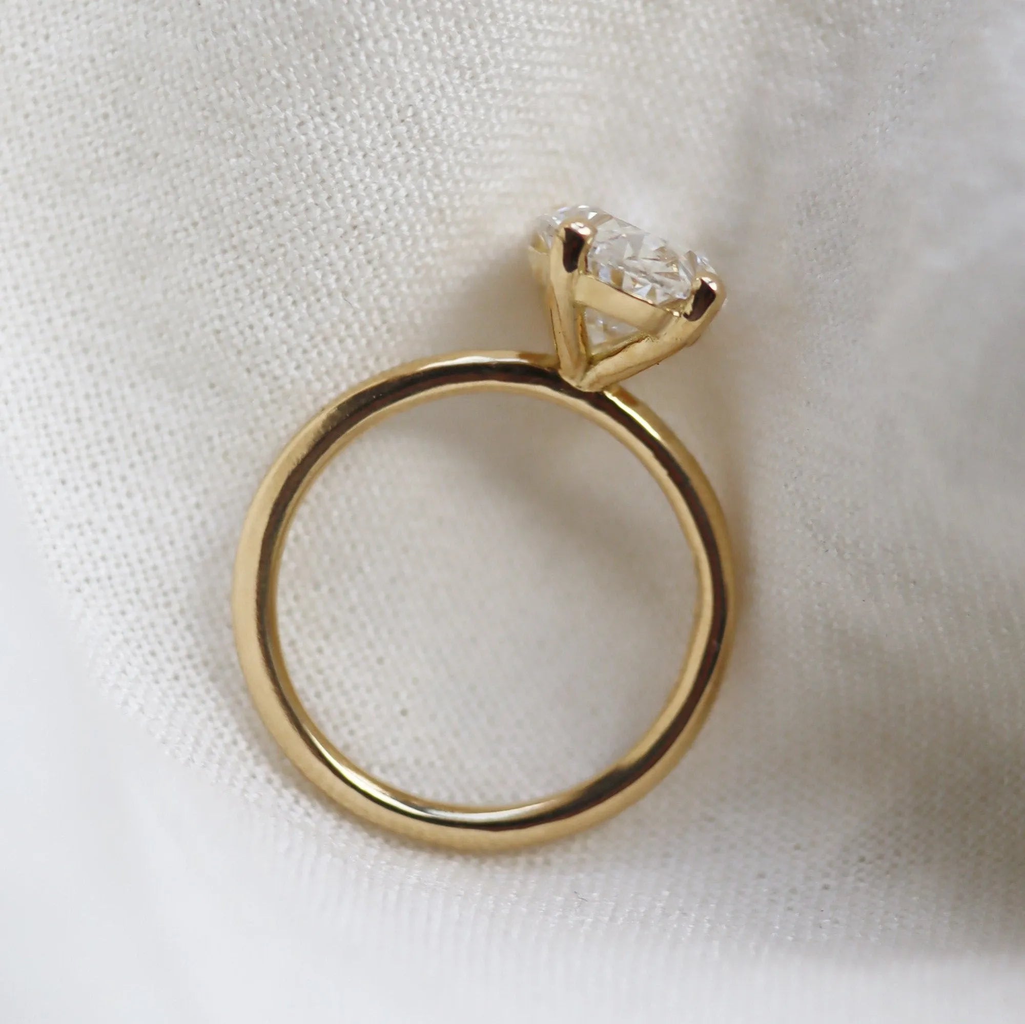 side angle of oval lab grown diamond engagement ring