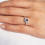 White Gold Bezel Set Blue Sapphire Engagement Ring with Round Diamonds