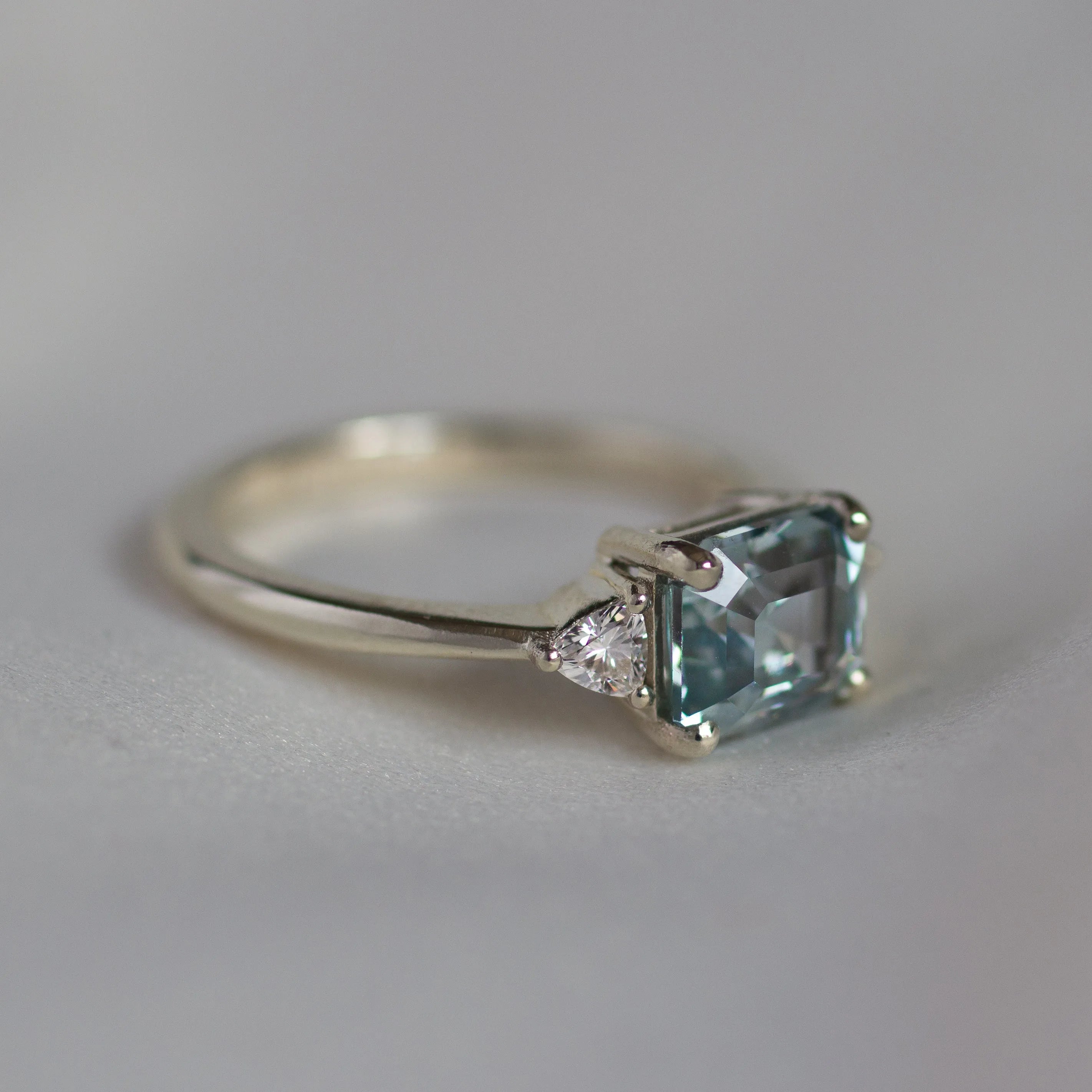 White Gold East-West Blue Emerald Cut Sapphire Engagement Ring