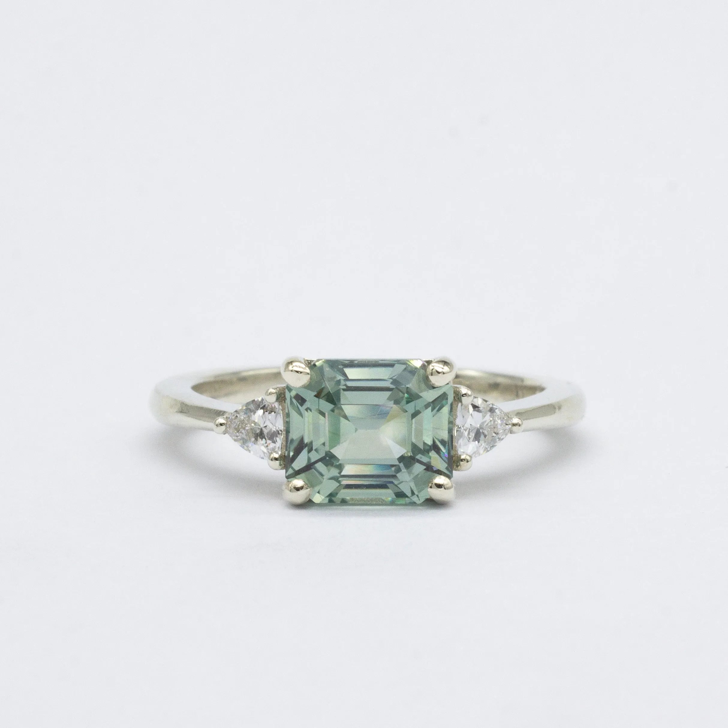 White Gold East-West Blue Emerald Cut Sapphire Engagement Ring