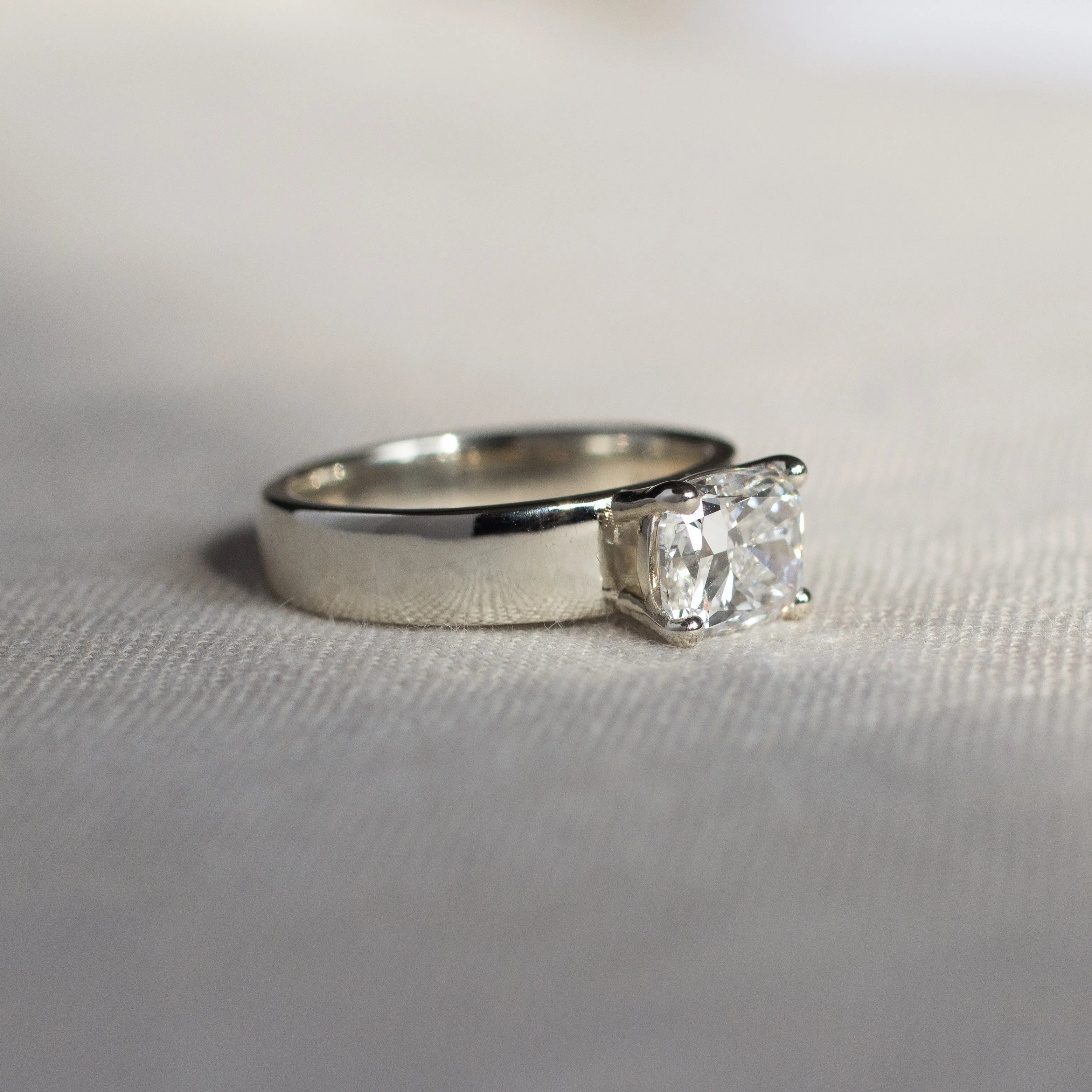 Wide Band Engagement Ring with Cushion Cut Diamond