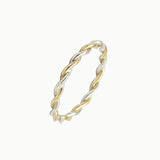 Two-tone twisted ring on a white background
