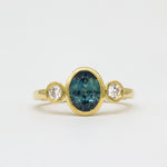 Yellow Gold Bezel Set Blue Sapphire Engagement Ring with Round Diamonds