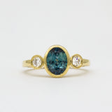 Yellow Gold Bezel Set Blue Sapphire Engagement Ring with Round Diamonds