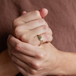 close up of mens hands wearing gold pinkie signet ring