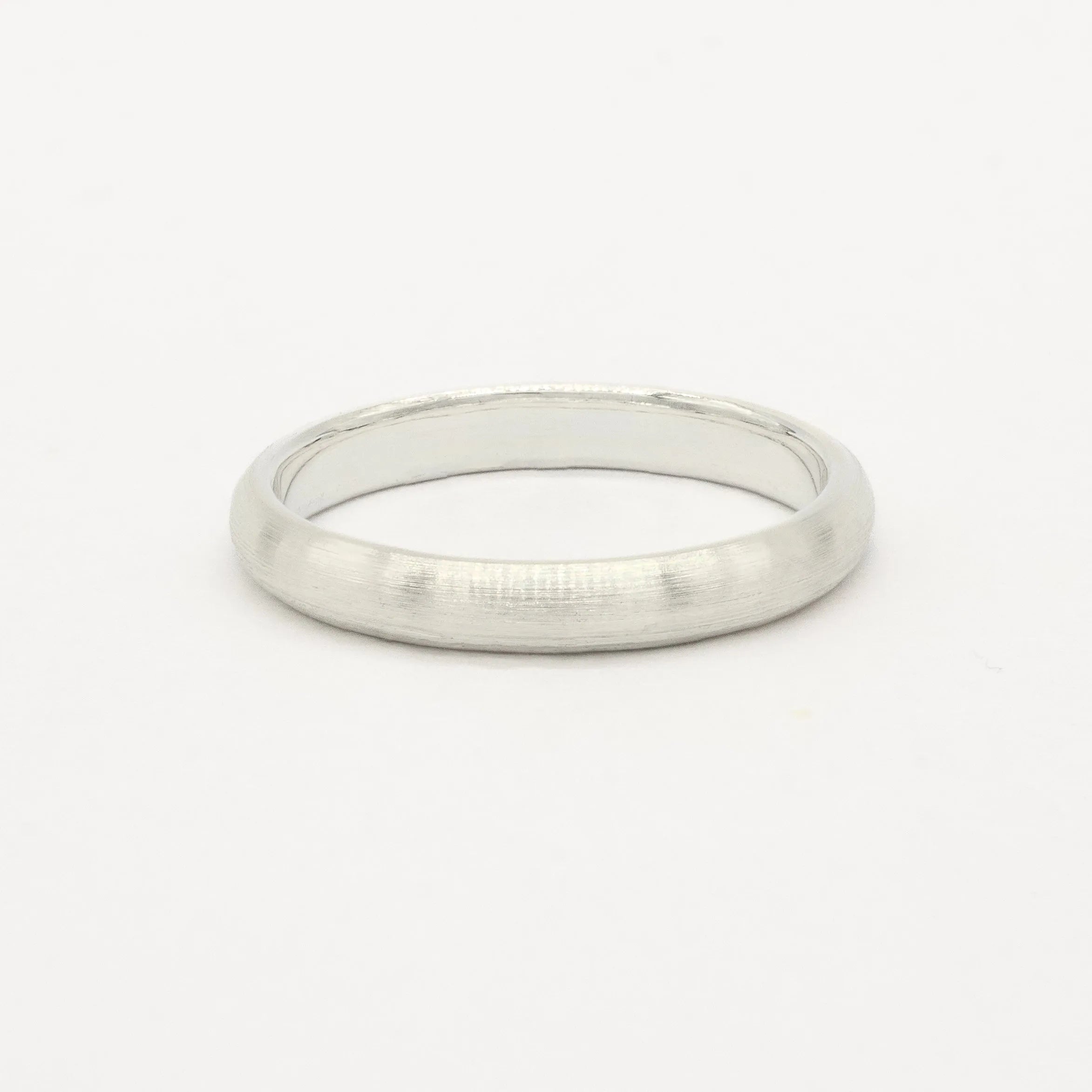 white gold 3mm brushed wedding ring on a white background
