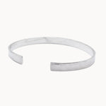 side angle of hammered textured chunky bangle