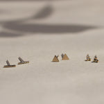 bar, triangle and triple dot gold stud earrings with leaf shadow