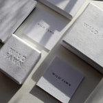 white packaging boxes with wild fawn engraving