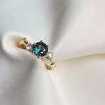 Asymmetrical Round Blue Sapphire Engagement Ring with Sprinkled Diamonds