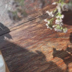 gift wrap jewellery box being unboxed to display earrings inside