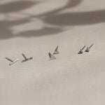 bar, triangle and triple dot silver stud earrnings with leaf shadow