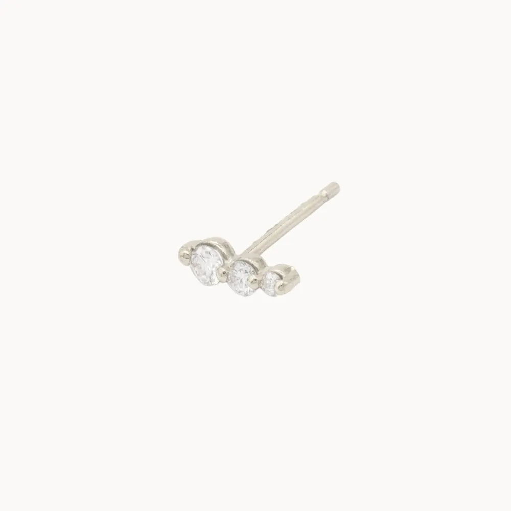 cut-out of left single climber diamond earring in white gold