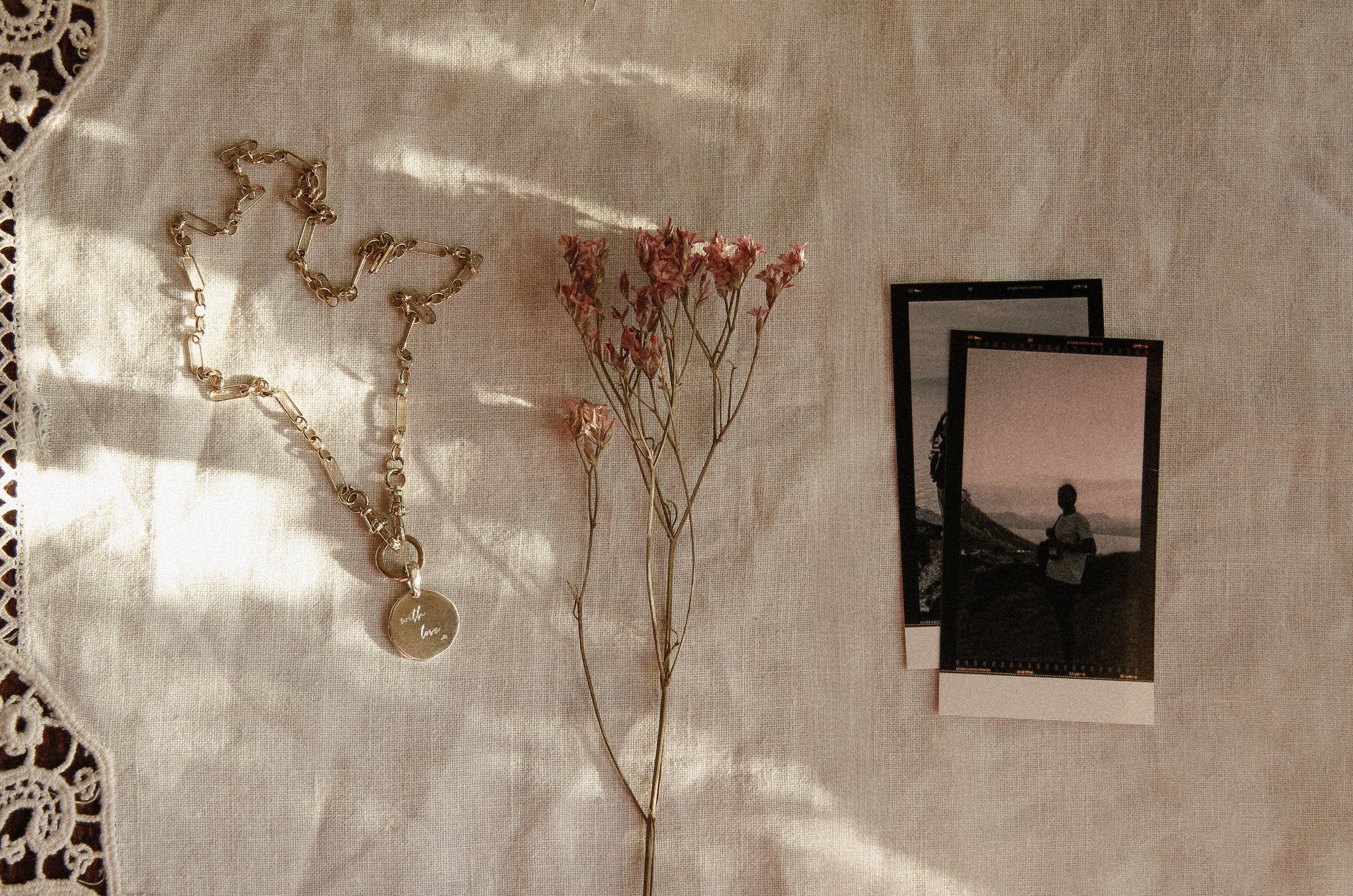 the best valentines day gifts for her necklace, flowers and printed photos
